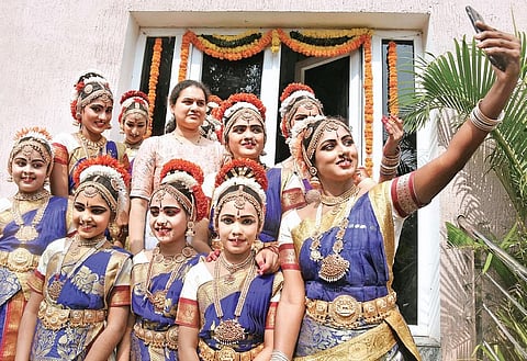 Dancers taking selfie with chess champion Koneru Humpy during National Youth Day at Tummalapalli Kalakshetram in Vijayawada on Sunday| P Ravindra Babu
