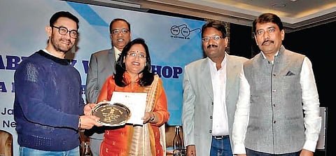 Bollywood actor Aamir Khan presents Peddapalli collector A Sridevasena the Swachh Darpan award in New Delhi on Sunday