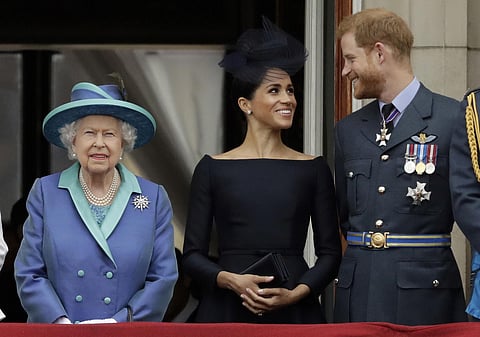 Britain's Queen Elizabeth II, Meghan and Prince Harry. (Photo | AP)