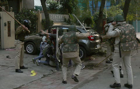 Unclaimed motorcycles, shards of broken window glasses, stones and footwear littered the roads near south Delhi's Jamia Millia Islamia university, which resembled a battle zone, after a protest against the amended citizenship law (Citizenship Act) on Sund