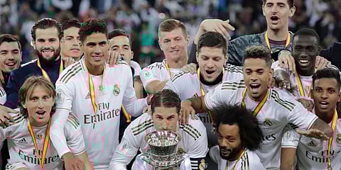 Real Madrid's Sergio Ramos kisses the trophy, at the end of the Spanish Super Cup Final soccer match between Real Madrid and Atletico Madrid at King Abdullah stadium in Jiddah, Saudi Arabia. (Photo | AP)