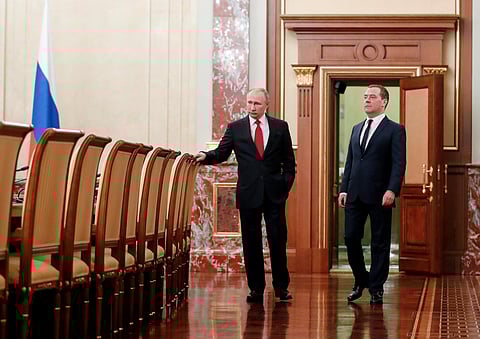 Russian President Vladimir Putin, right, and Russian Prime Minister Dmitry Medvedev talk to each other prior to a cabinet meeting in Moscow, Russia. (Photo | AP)