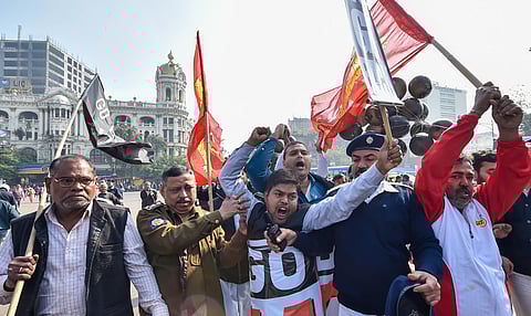 Police personnel attempt to stop activists during a rally to protest against Prime Minister Narendra Modi's visit in Kolkata on Sunday (Photo| PTI)