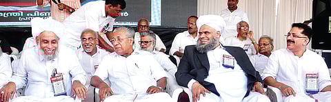 Chief Minister Pinarayi Vijayan and Sayyid Muhammad Jifri Muthukkoya Thangal, president of EK faction of Samastha, sharing a light moment at the inaugural function of the ‘Constitutation Protection Maha Rally’ in Malappuram on Thursday | Express