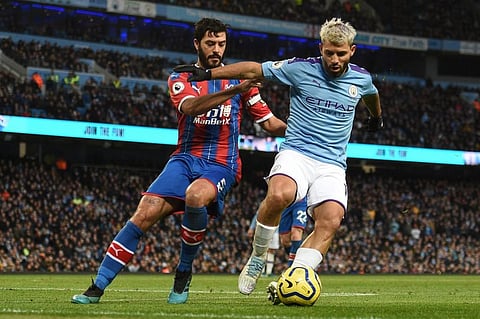 Crystal Palace's English defender James Tomkins (L) vies with Manchester City's Argentinian striker Sergio Aguero during the English Premier League football match between Manchester City and Crystal Palace. (Photo | AP)