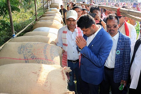 AASU general secretary Lurinjyoti Gogoi offering prayers at the site where the paddy has been stored (Photo | EPS)