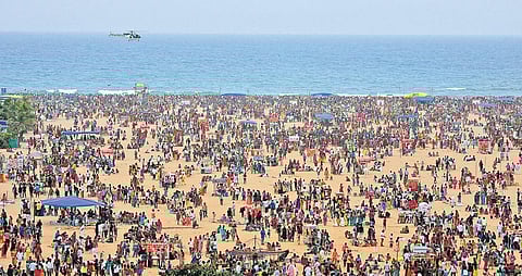 Coast Guards chopper on surveillance at the Marina beach on Kaanum Pongal, on Friday;