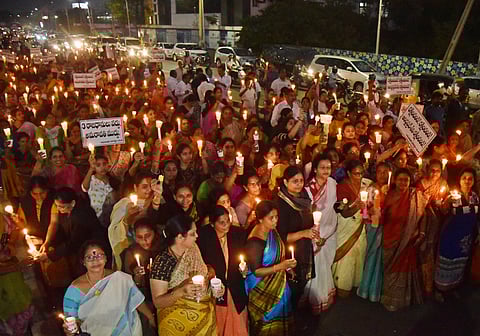 Amaravathi Parirakshana Samithi JAC took out candle rally aganist three capitals proposal at BRTS road in Vijayawada on Saturday| Express