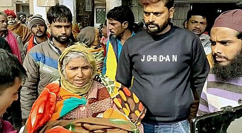 An elderly woman carrying a child at the JK Lon Hospital in Kota on Thursday (Photo| ANI)