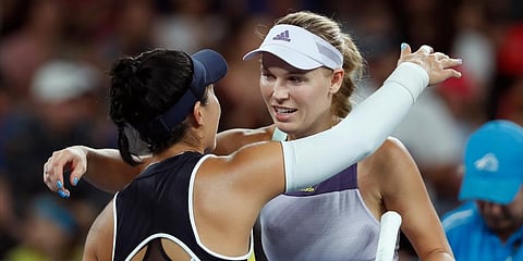 Denmark's Caroline Wozniacki, right, is congratulated by United States' Kristie Ahn after winning their first round singles match at the Australian Open tennis championship in Melbourne. (Photo | AP)