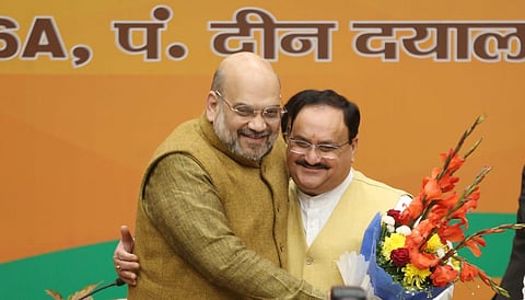 Union Home Minister Amit Shah hugs BJP's national president JP Nadda. (Photo | EPS/Shekhar Yadav)