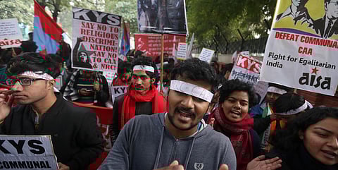 Students hold placards as they shout slogans to protest against India's new citizenship law during a demonstration in New Delhi on Monday. (Photo | Shekhar Yadav/EPS)