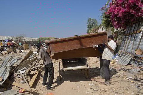 A lot of sheds which are homes for a lot of people from other parts of Karnataka in a settlement near Kariyammana Agrahara next to Sakra Hospital have been demolished despite them having all the documents in Bengaluru on Monday. (Photo | Meghana Sastry/EP