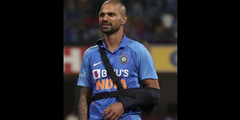 India's Shikhar Dhawan uses a sling to rest his arm during the presentation ceremony after their win in the third one-day international cricket match between India and Australia in Bangalore. (Photo | AP)
