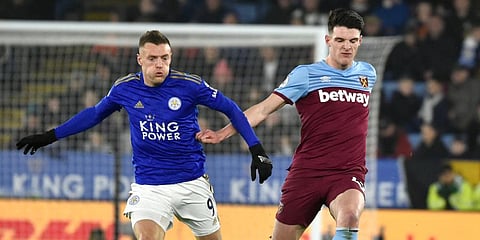 Leicester's Jamie Vardy, left, and West Ham's Declan Rice challenge for the ball during the English Premier League soccer match between Leicester City and West Ham Utd at the King Power Stadium in Leicester. (Photo | AP)