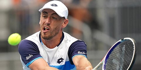 Australia's John Millman makes a backhand return to Poland's Hubert Hurkacz during their second round singles match at the Australian Open tennis championship in Melbourne. (Photo | AP)