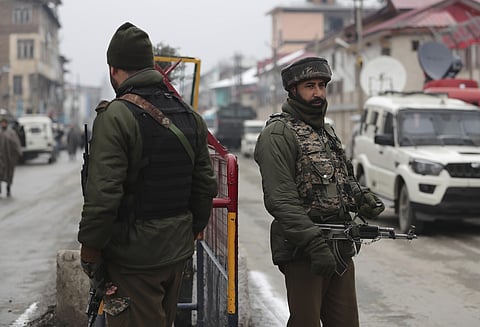 Indian policemen stand guard outside police control room after a wreath laying ceremony for their colleague in Srinagar, India, Wednesday, Jan. 22, 2020. (Photo | AP)