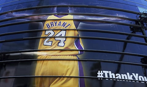 A giant banner congratulating Kobe Bryant is draped around Staples Center before his last NBA basketball game in downtown Los Angeles. (Photo | AP)