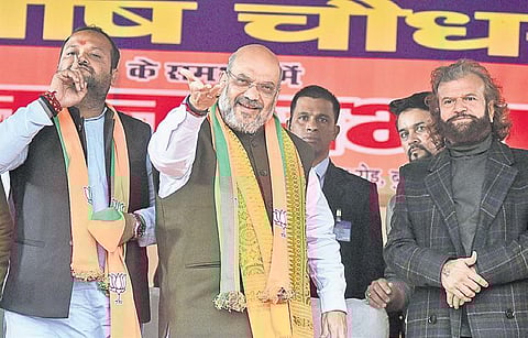 Union Home Minister Amit Shah during an election campaign ahead at the Rithala Assembly constituency in New Delhi on Monday. He railed against the CM and urged people to think before voting on October 8 | Parveen Negi