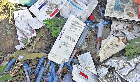 Medical waste dumped along the Outer Ring Road in Vandalur | Express