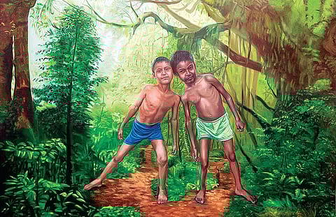 Artist Rajesh Ram with his artworks