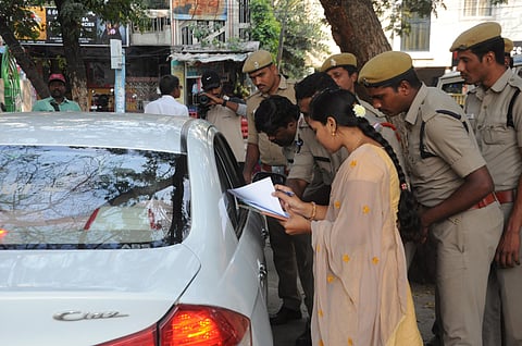 Police takes the details of arrested farmers who came from Karnataka to support capital area farmers in staging protest aganist three capitals proposal at Vijayawada airport on Monday. (Photo| Prasant Madugula, EPS)