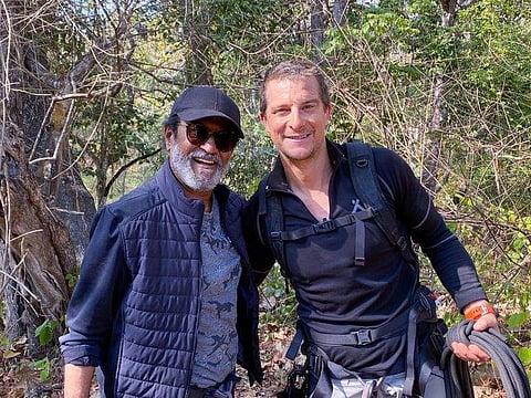 British adventurer Bear Grylls with actor Rajinikanth after shooting an episode of 'Man vs Wild' at Bandipur forest in Karnataka. (Photo | Twitter/ANI)