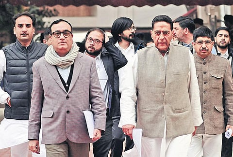 Congress leader Ajay Maken (left) with Delhi Pradesh Congress Committee chief Subhash Chopra (right) outside the Election Commission office on Tuesday. (Photo| EPS)