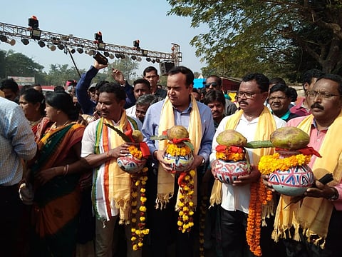 Collector Manish Agarwal and other district officials carrying holy water to the venue of Malyabanta Mahotsav in Malkangiri. (Photo | EPS)