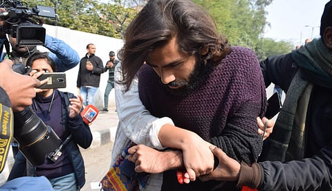 A student of the Jamia Millia Islamia university injured after an unidentified person allegedly opened firing during an anti-CAA protest is assisted towards a hospital in New Delhi Thursday Jan. 30 2020. (Photo | EPS)