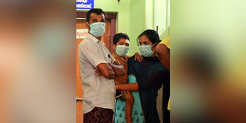 Visitors wearing masks as a precaution against the coronavius infection at the General Hospital in Thrissur. (Photo| EPS)