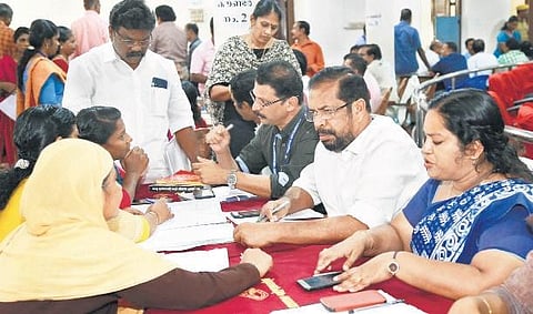 Mayor K Sreekumar and Deputy Mayor Rakhi Ravikumar hearing the complainants at the adalat on Thursday. (photo| EPS)