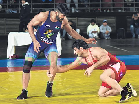 Jitender Kumar (R) in action against Sandeep Mann during the Olympic qualifiers selection trials at the IG Stadium in New Delhi on Friday. (Photo| EPS/PARVEEN NEGI)