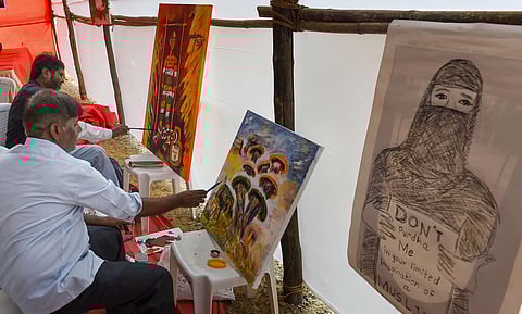 Artists make painting for protests against the Citizenship Amendment Act and National Register of Citizenship in Mumbai Saturday Jan. 4 2020. (Photo | PTI)