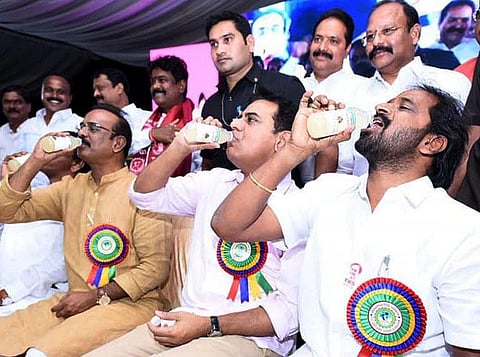 Ministers KT Rama Rao, Srinivas Goud and former MP Boora Narsaiah Goud drinking Neera, during a meeting with the Gouda community in Hyderabad on Saturday. (Photo | EPS)