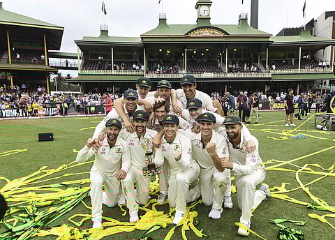 Australian captain Tim Paine and team mates with the Trans-Tasman Trophy. (Photo | AP)
