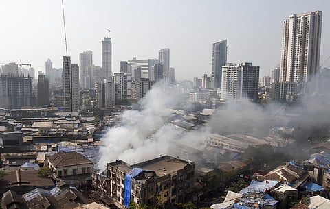 Smoke billows out of a building where a broke out at Kamathipura in Mumbai. (Photo | PTI)