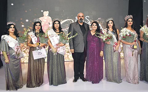 Barkha Nangia (centre) strikes a pose with the judges and finalists at the pageant.