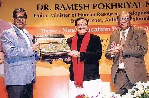 Union HRD Minister Ramesh Pokhriyal Nishank being felicitated by SOA founder president Prof Manojranjan Nayak in Bhubaneswar on Monday. (Photo | EPS)