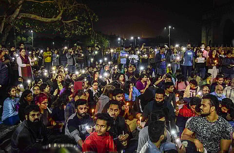 People protested against the attack on JNU students throughout the night in front of the Gateway of India. (Photo | PTI)