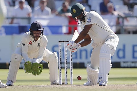 South Africa's Vernon Philander (R) plays a shot as England's Jos Buttler (L) looks on during the fifth day of the second Test cricket match between South Africa and England at the Newlands stadium in Cape Town. (Photo | AFP)