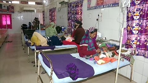 Family members with their children admitted into a hospital.