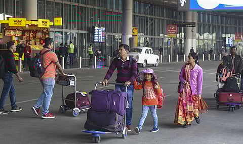 Flight passengers walk for transport vehicles outside the NSCBI Airport as taxies were off the roads due to the nationwide strike called by trade unions in Kolkata Wednesday Jan. 8 2020. (Photo | PTI)