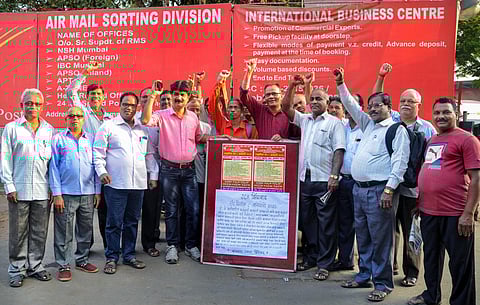 Members of a trade union stage a protest during the 24-hour nationwide strike called by ten trade unions against the central government over various issues in Mumbai (Photo| PTI)