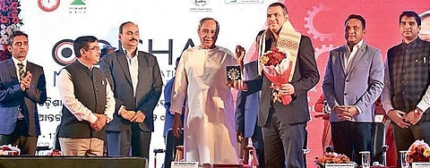 Chief Minister Naveen Patnaik felicitating an entrepreneur during MSME International Trade Fair in Bhubaneswar on Wednesday. (Photo | Biswanath Swain, EPS)