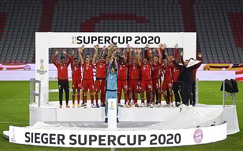 Players of Bayern Munich with goalkeeper and captain Manuel Neuer, center, celebrate after winning the German Bundesliga Supercup. (Photo | AP)