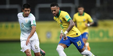 Brazil's Neymar (R) runs with the ball as Bolivia's Diego Wayar challenges him during a qualifying soccer match for the FIFA World Cup Qatar 2022. (Photo| AP)