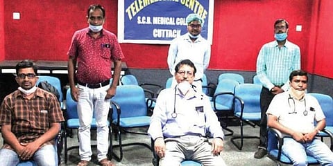 Prof Bidyut Das (C) and his team of doctors at SCB Medical College and Hospital in Cuttack. (Photo | EPS)