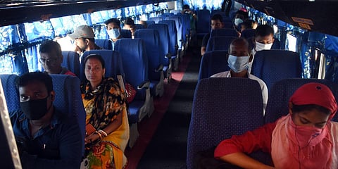 Passengers wearing face masks to protect from Coronavirus threat while travelling on a private bus. (FilePhoto | Biswanath Swain)