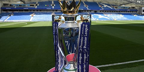 The Premier league trophy sits beside the pitch ahead of the English Premier League football match. (File photo| AFP)